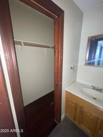 a bathroom with a sink and mirror