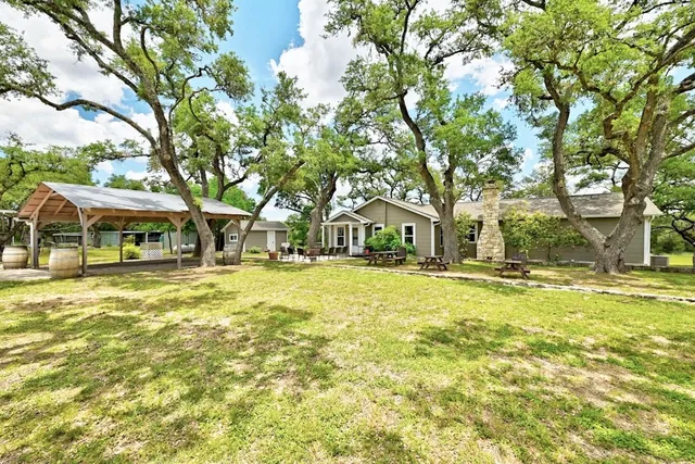 a kitchen with stainless steel appliances a refrigerator sink and cabinets