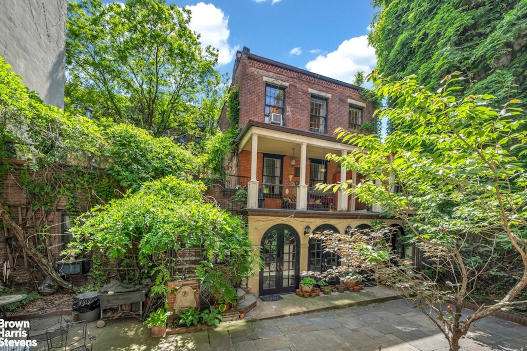 422 West 46th Street, Unit 2R Manhattan, NY 10036 - Photo 1 of 10 front view of a house with a tree