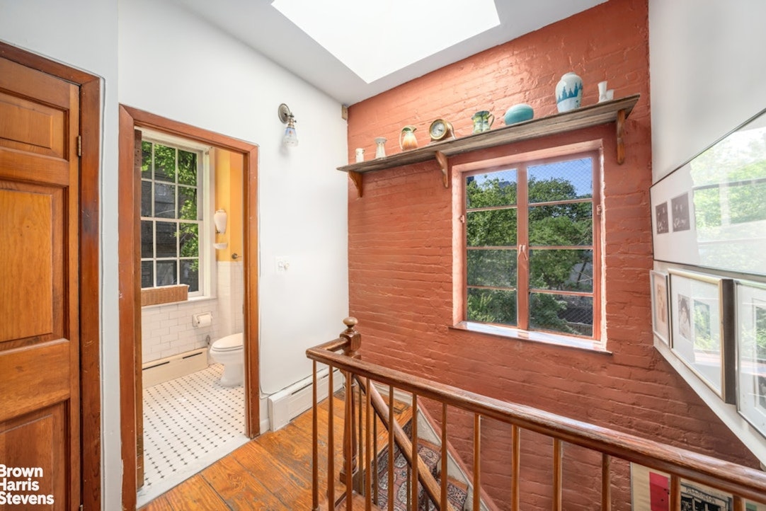 422 West 46th Street, Unit 2R Manhattan, NY 10036 - Photo 9 of 10 a view of a house with large windows