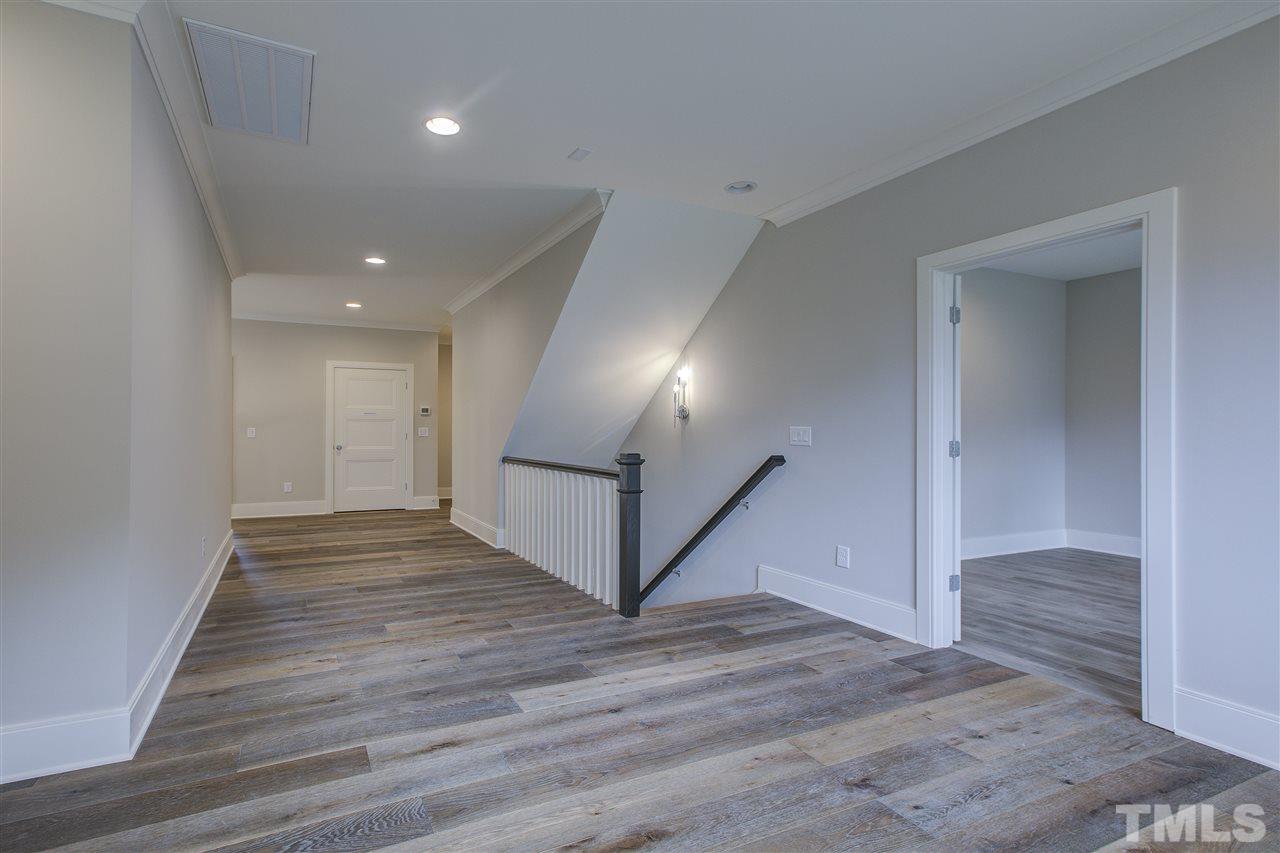 3061 Eden Harbor Court Raleigh, NC 27613 - Photo 22 of 30 a view of a hallway with wooden floor