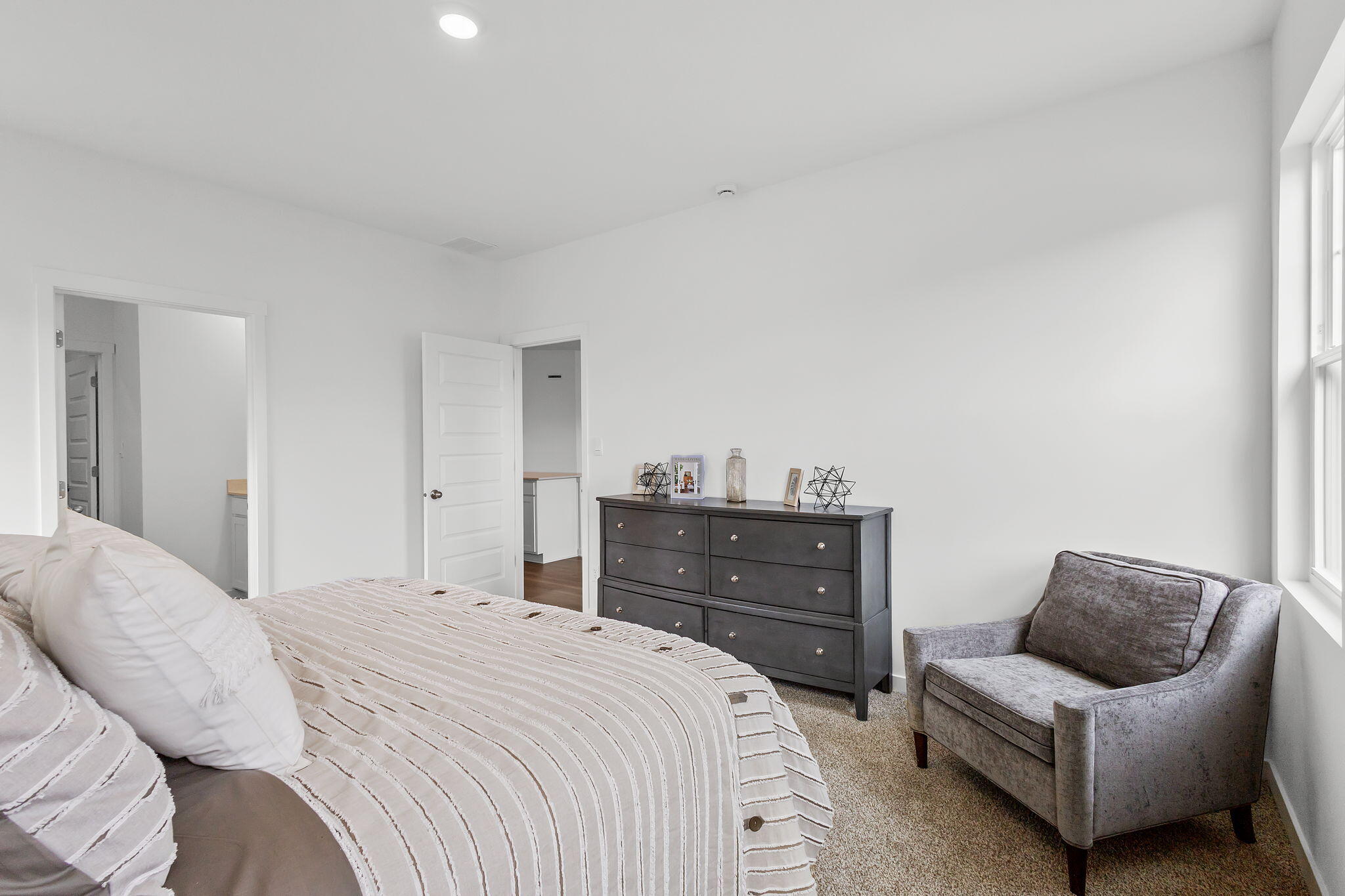 7486 East 116th Place Crown Point, IN 46307 - Photo 11 of 25 a bedroom with a bed and a couch