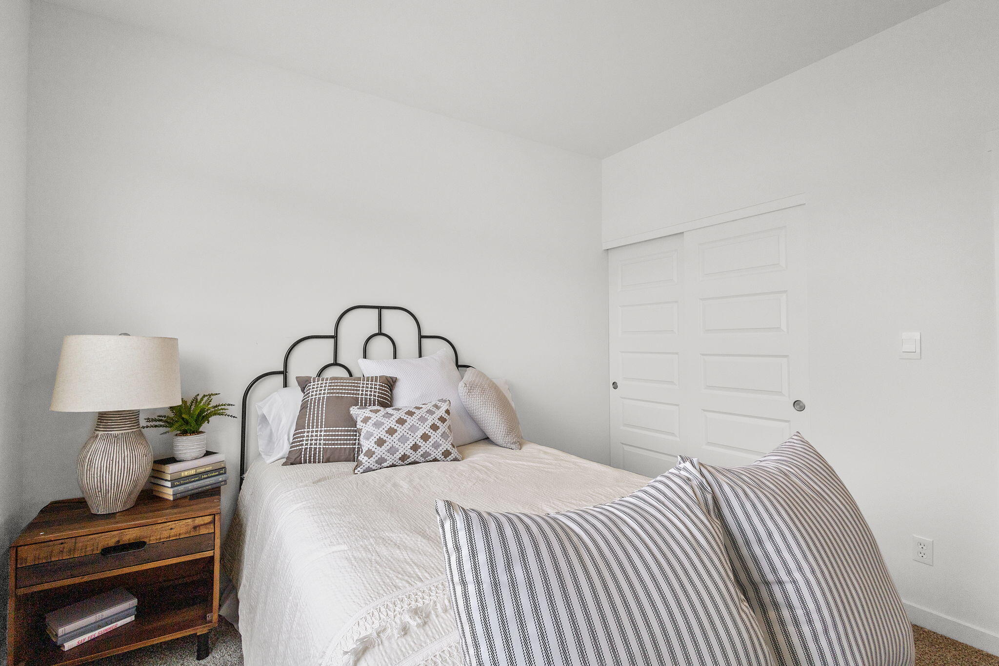 7486 East 116th Place Crown Point, IN 46307 - Photo 17 of 25 a bedroom with a bed and a lamp on dresser