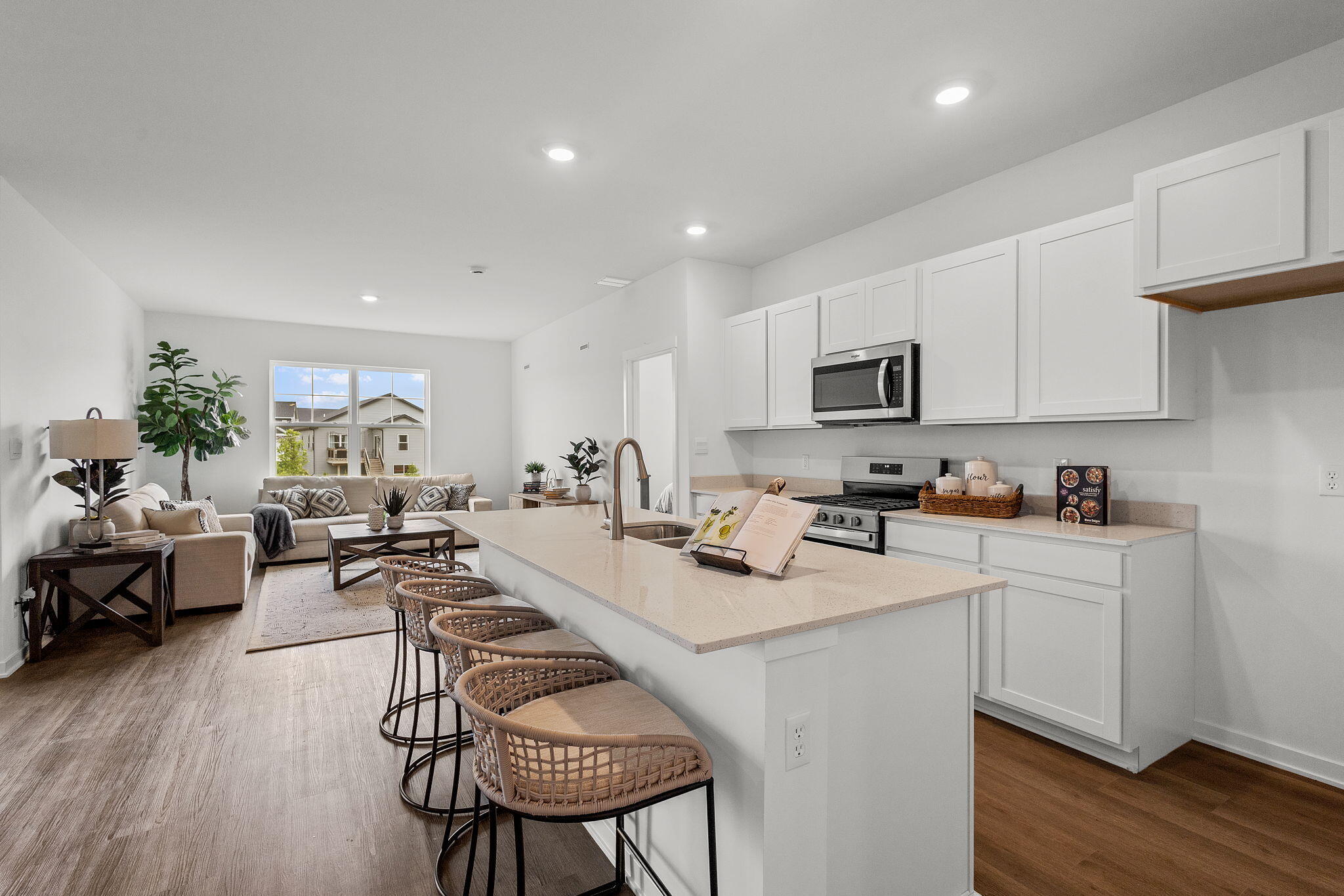7486 East 116th Place Crown Point, IN 46307 - Photo 2 of 25 a living room with furniture a wooden floor and a sink