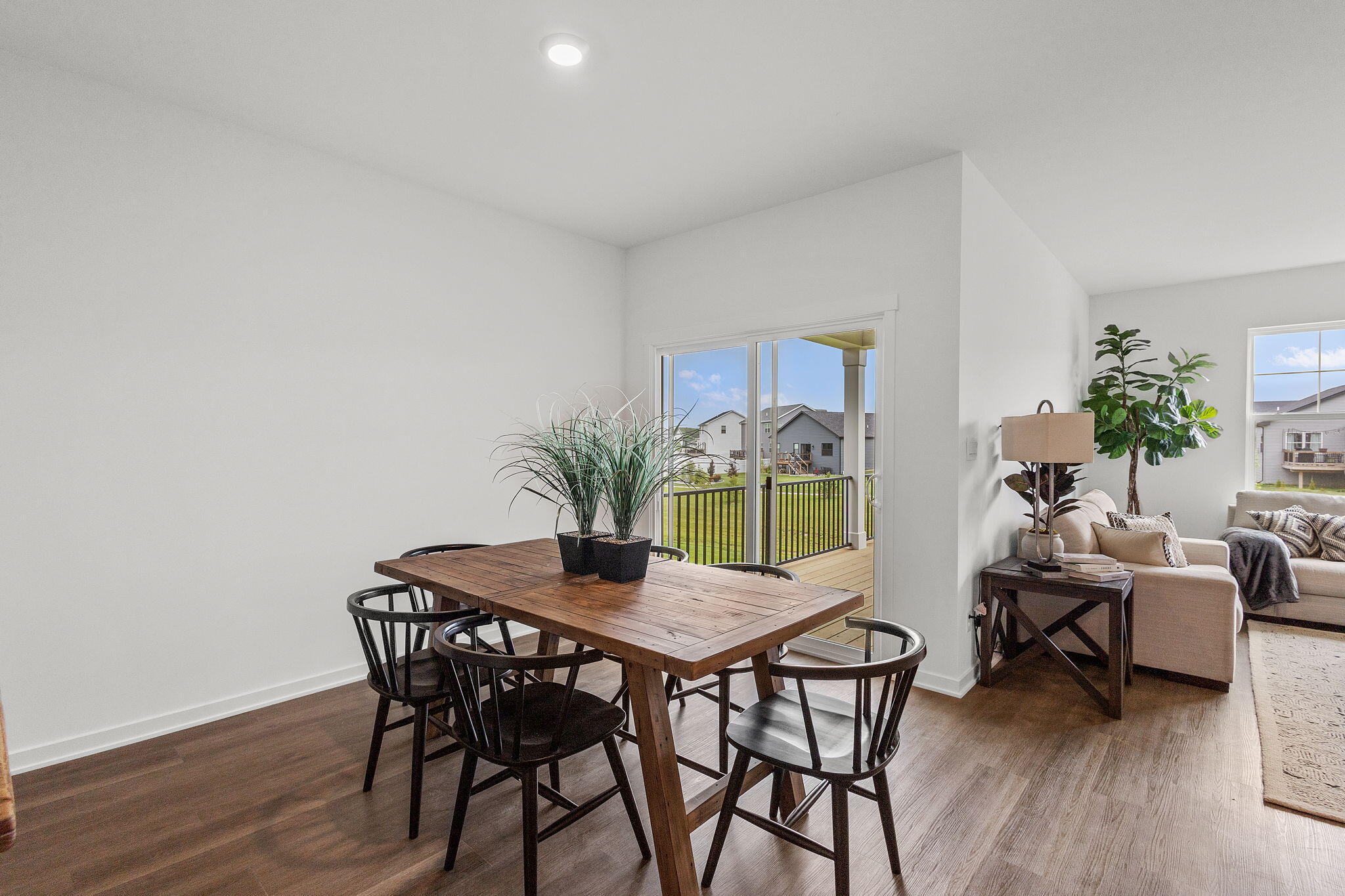 7486 East 116th Place Crown Point, IN 46307 - Photo 5 of 25 a view of a dining room with furniture and wooden floor