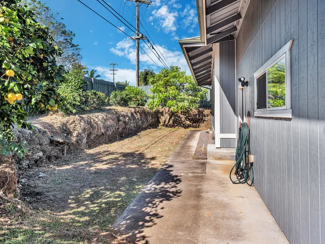 a view of a backyard with sitting area