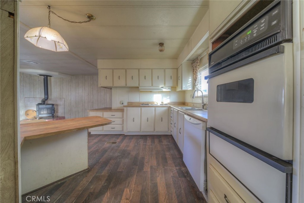 52565 Wheeler Road Anza, CA 92539 - Photo 14 of 54 a kitchen with cabinets a sink and appliances