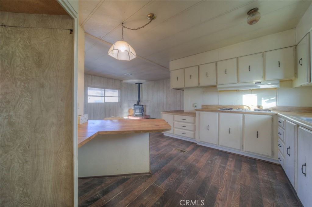 52565 Wheeler Road Anza, CA 92539 - Photo 15 of 54 a kitchen with stainless steel appliances granite countertop a sink a stove and cabinets