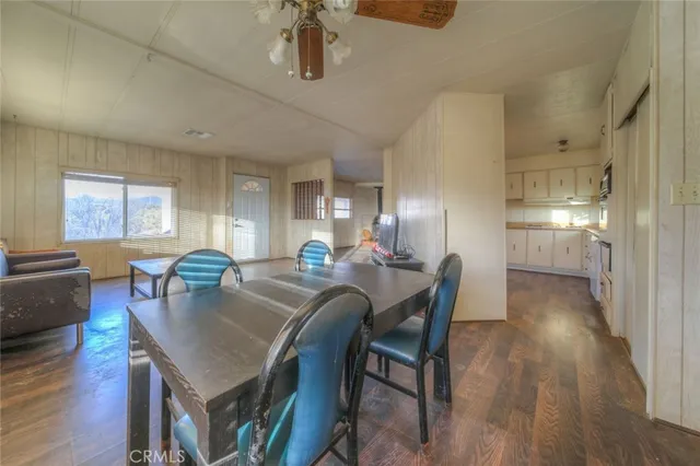 a kitchen with cabinets a sink and wooden floor