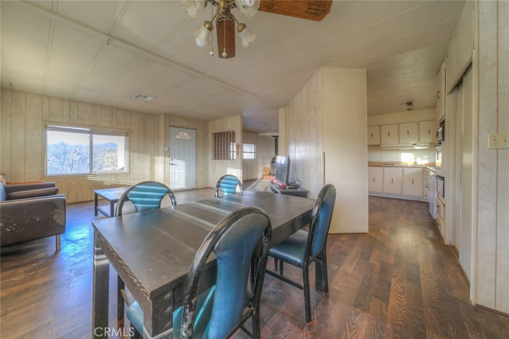 52565 Wheeler Road Anza, CA 92539 - Photo 19 of 54 a view of a dining room with furniture and wooden floor