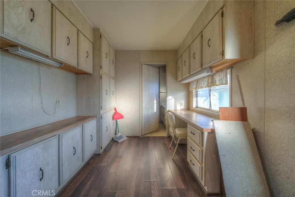 52565 Wheeler Road Anza, CA 92539 - Photo 20 of 54 a kitchen with cabinets a sink and wooden floor