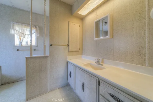 a bathroom with a shower and a sink