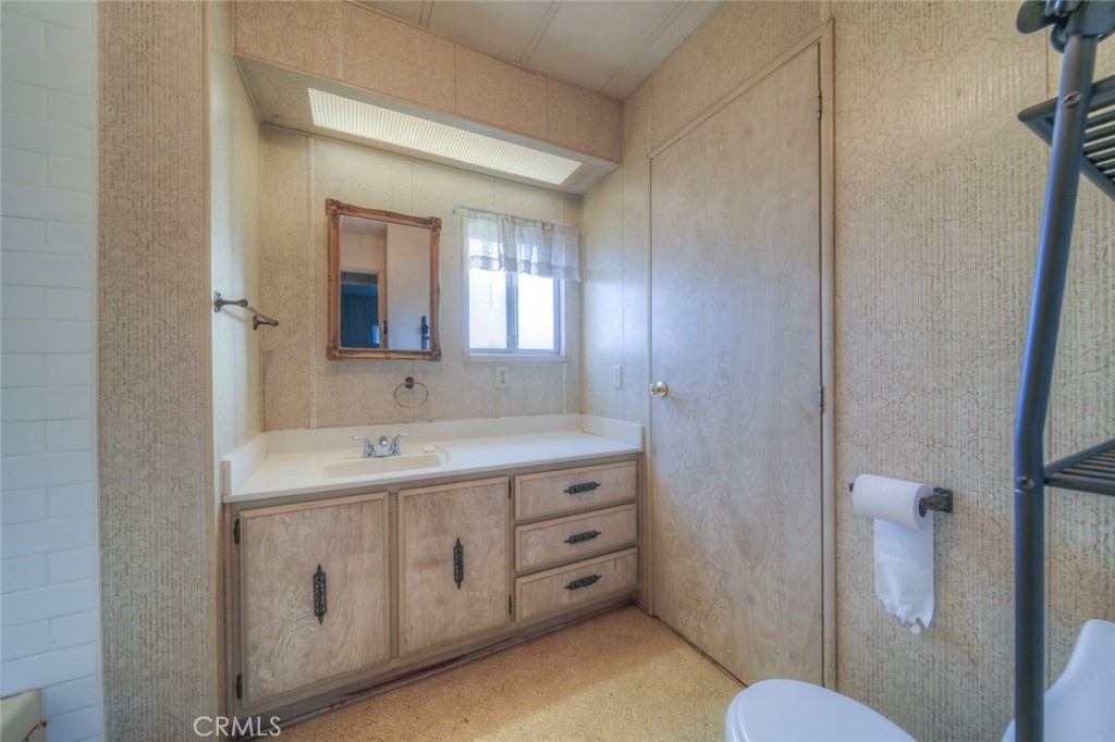 52565 Wheeler Road Anza, CA 92539 - Photo 34 of 54 a spacious bathroom with a double vanity sink a toilet and a mirror