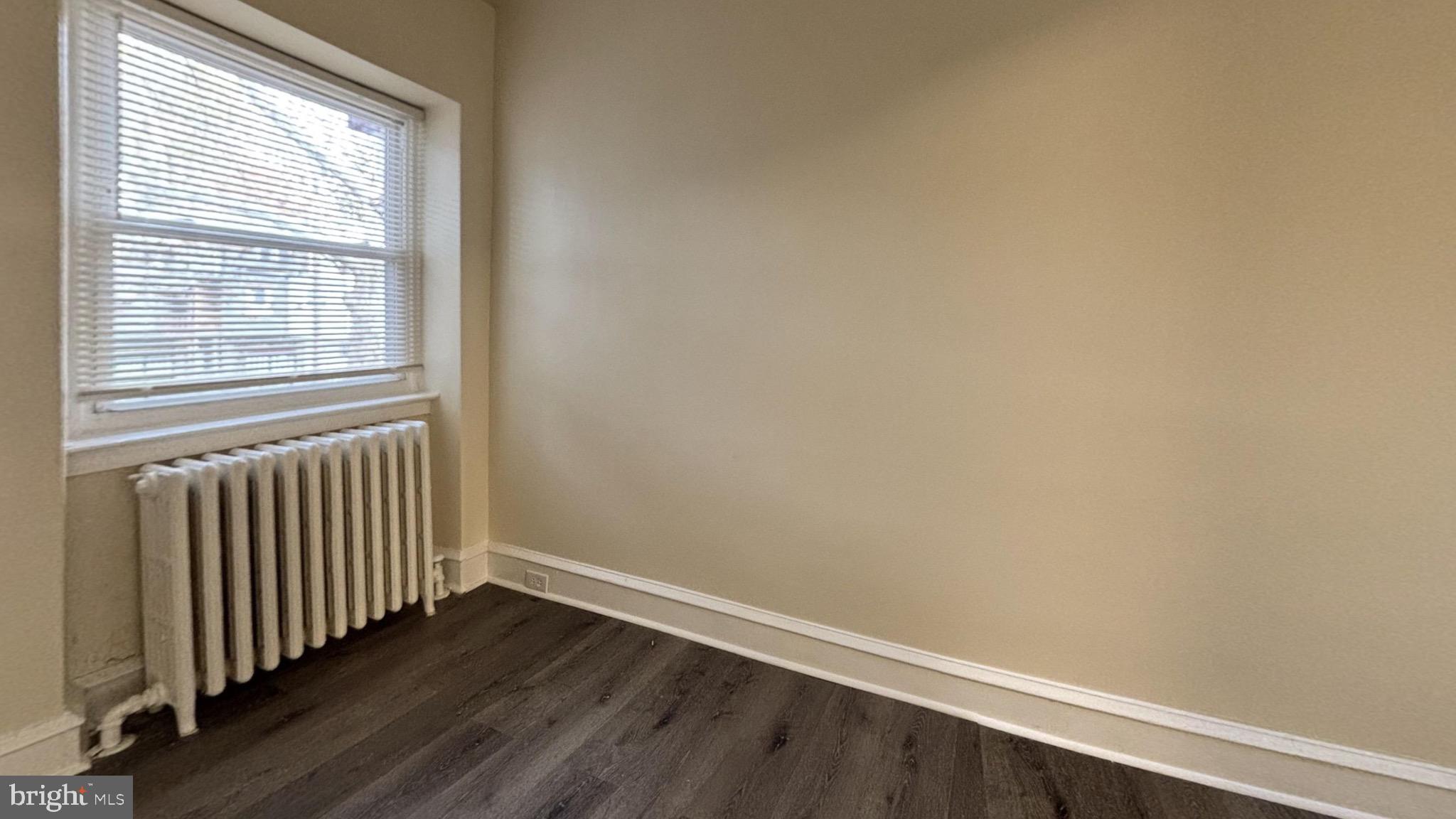 7246 Lamport Road Upper Darby, PA 19082 - Photo 9 of 10 an empty room with wooden floor and windows