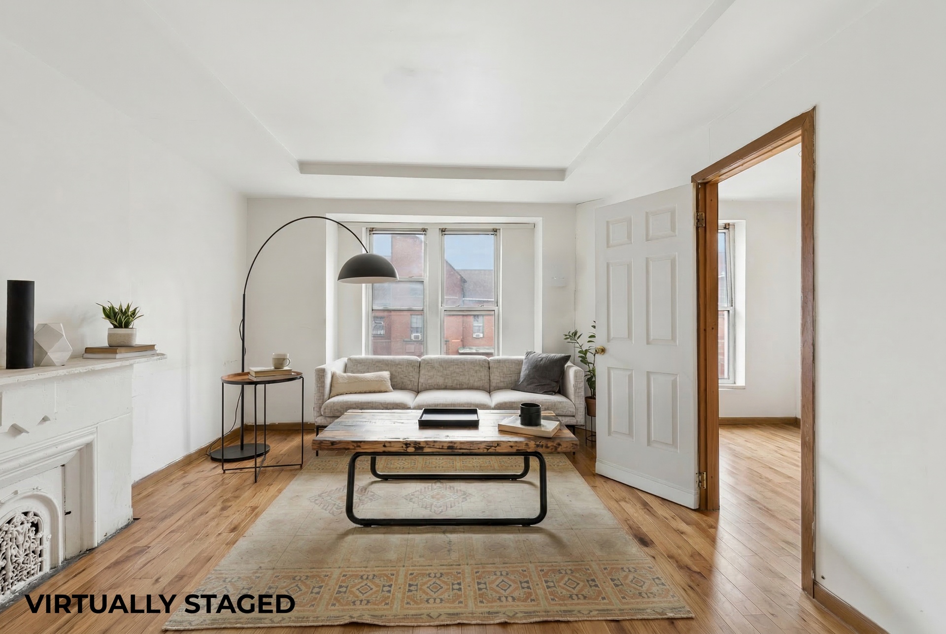 772 Greene Avenue Brooklyn, NY 11221 - Photo 1 of 7 a living room with furniture and a potted plant