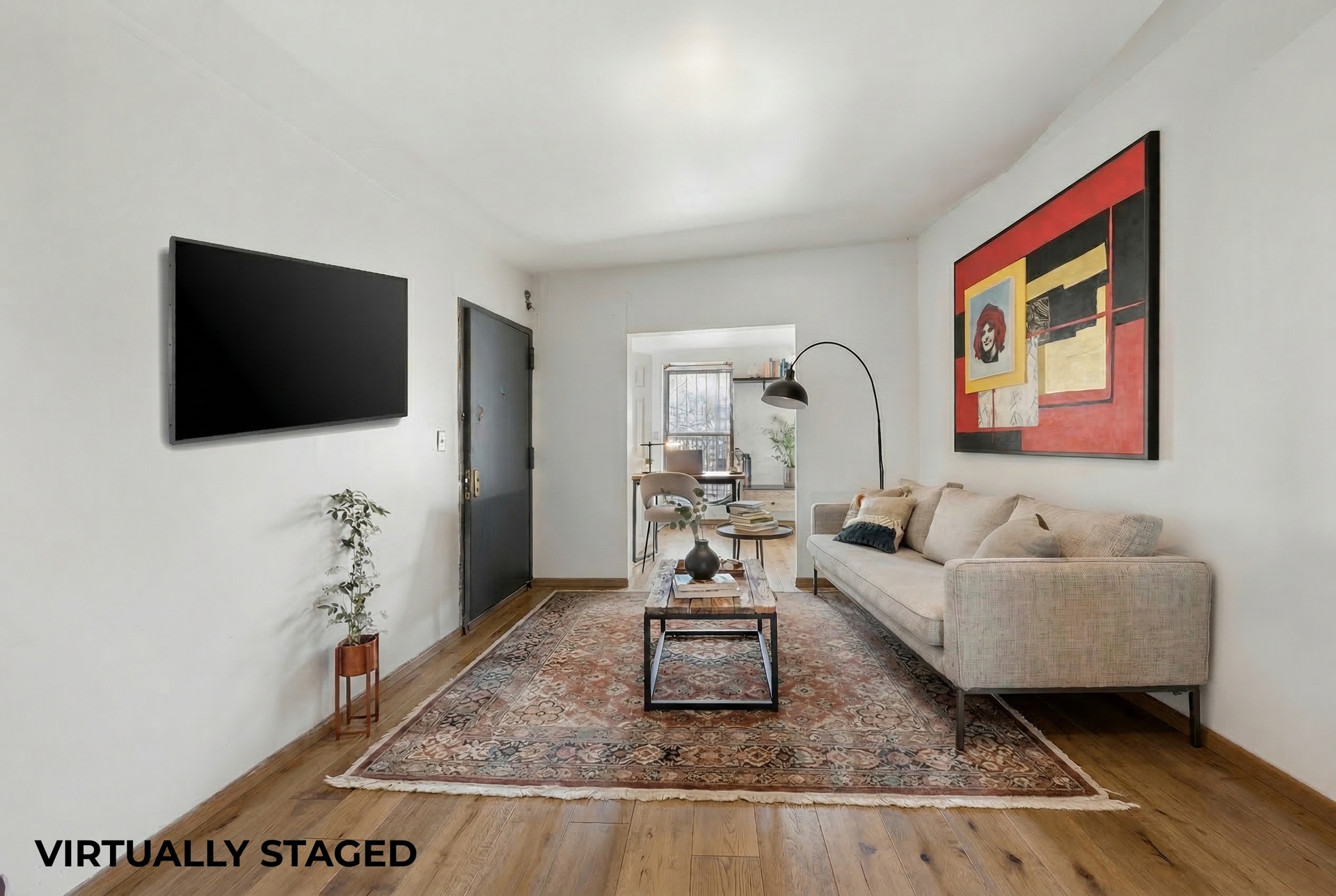 772 Greene Avenue Brooklyn, NY 11221 - Photo 2 of 7 a living room with furniture and a flat screen tv
