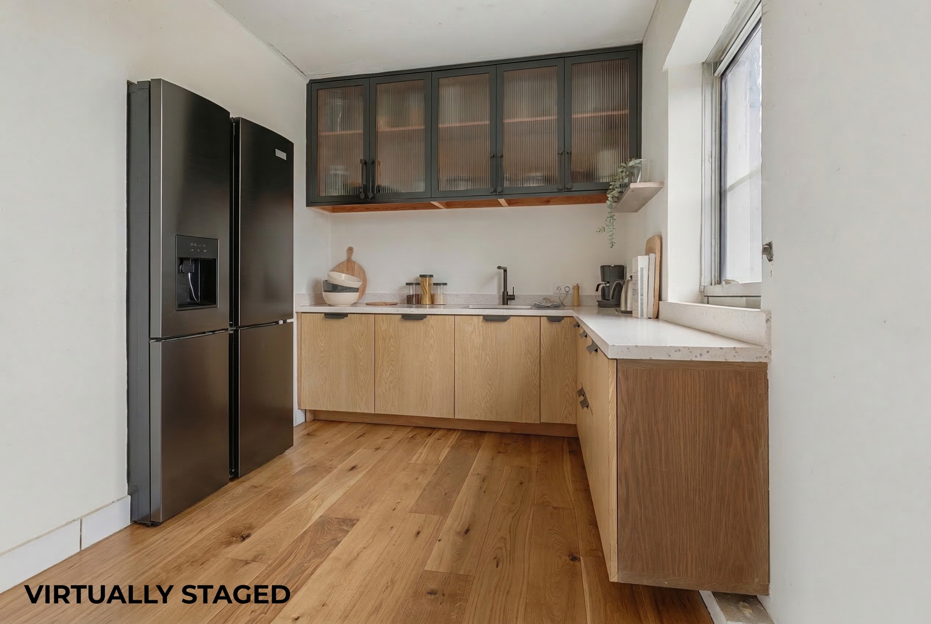 772 Greene Avenue Brooklyn, NY 11221 - Photo 3 of 7 a kitchen with a refrigerator a sink and wooden cabinets