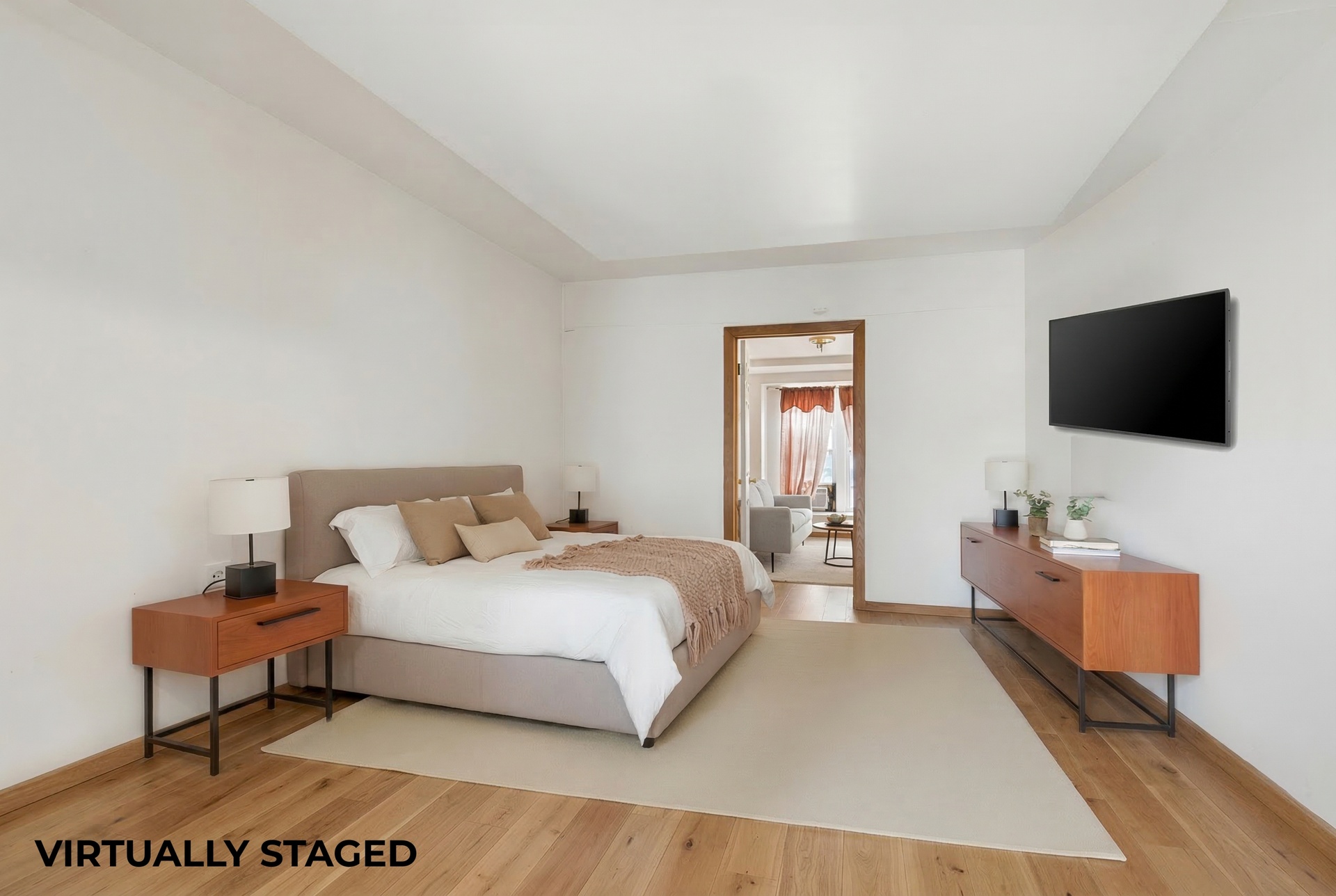 772 Greene Avenue Brooklyn, NY 11221 - Photo 4 of 7 a bedroom with a bed and a flat screen tv