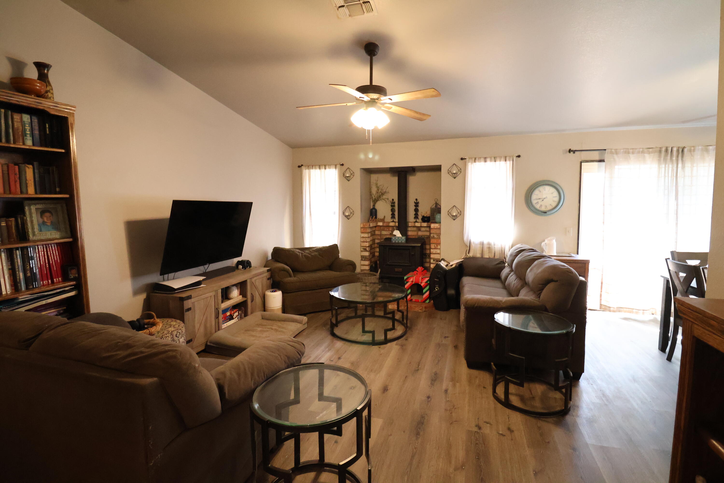 3528 Silverwood Street Redding, CA 96002 - Photo 2 of 13 a living room with furniture and a flat screen tv