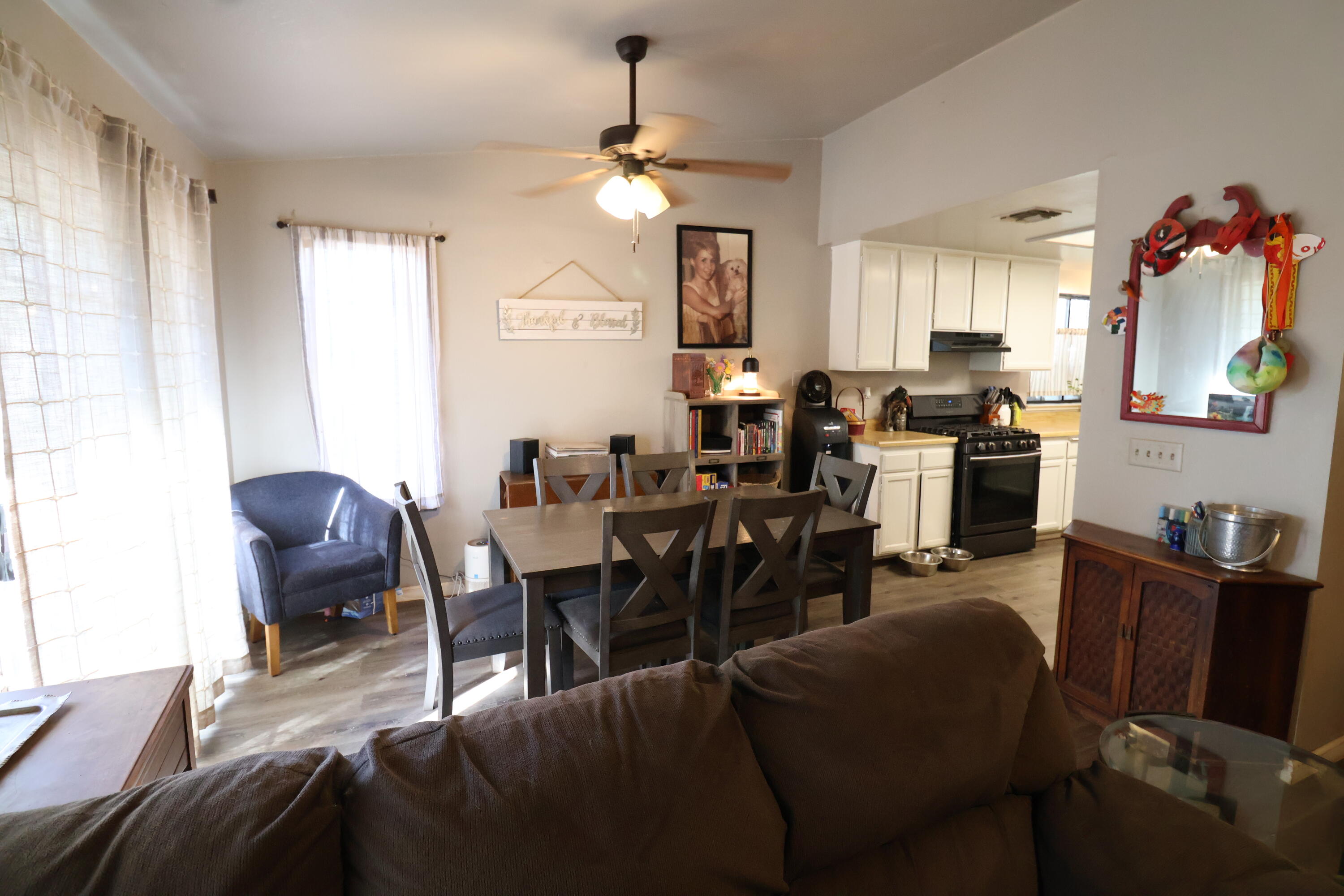 3528 Silverwood Street Redding, CA 96002 - Photo 5 of 13 a view of a dining room with furniture and chandelier