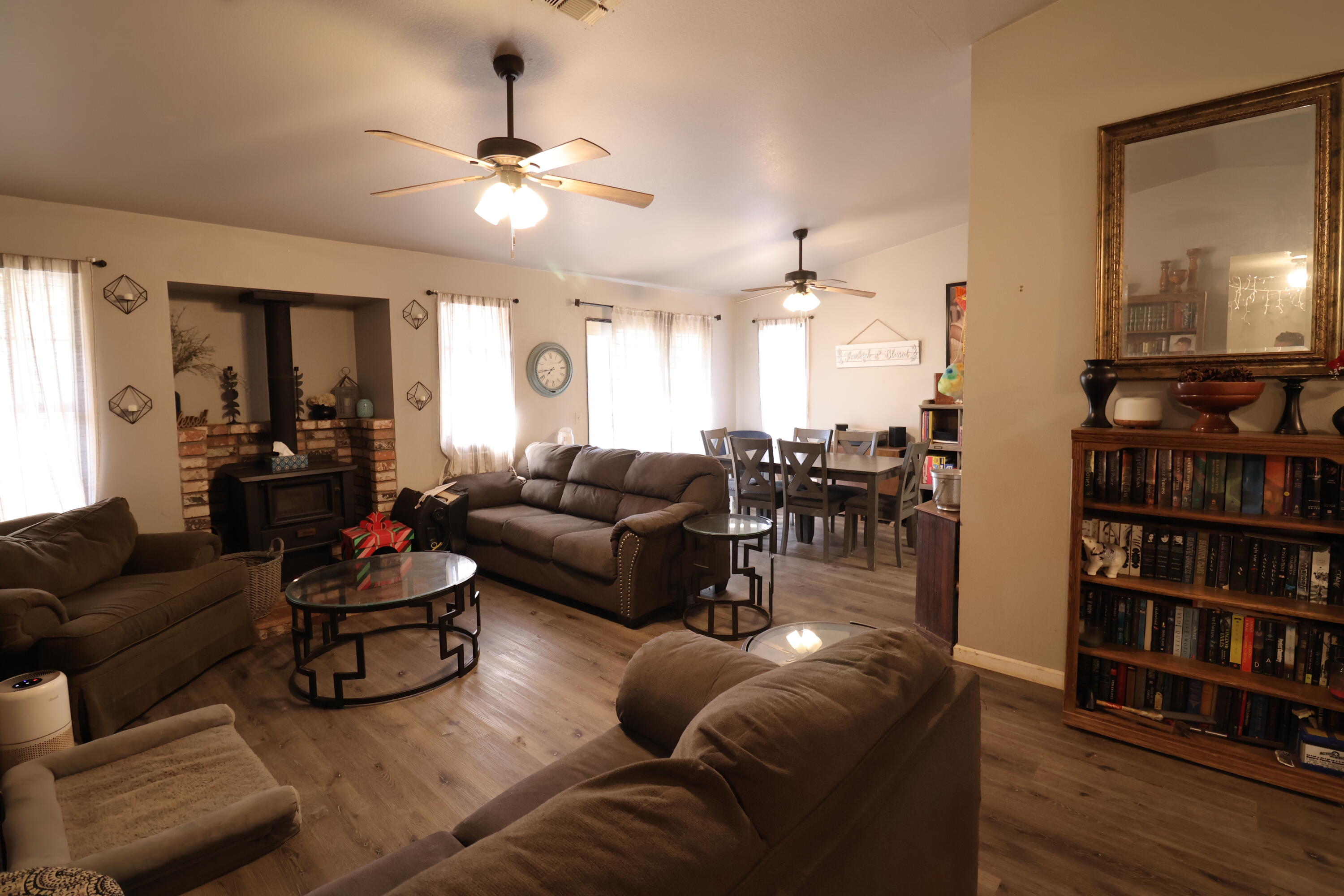 3528 Silverwood Street Redding, CA 96002 - Photo 6 of 13 a living room with furniture and a book shelf