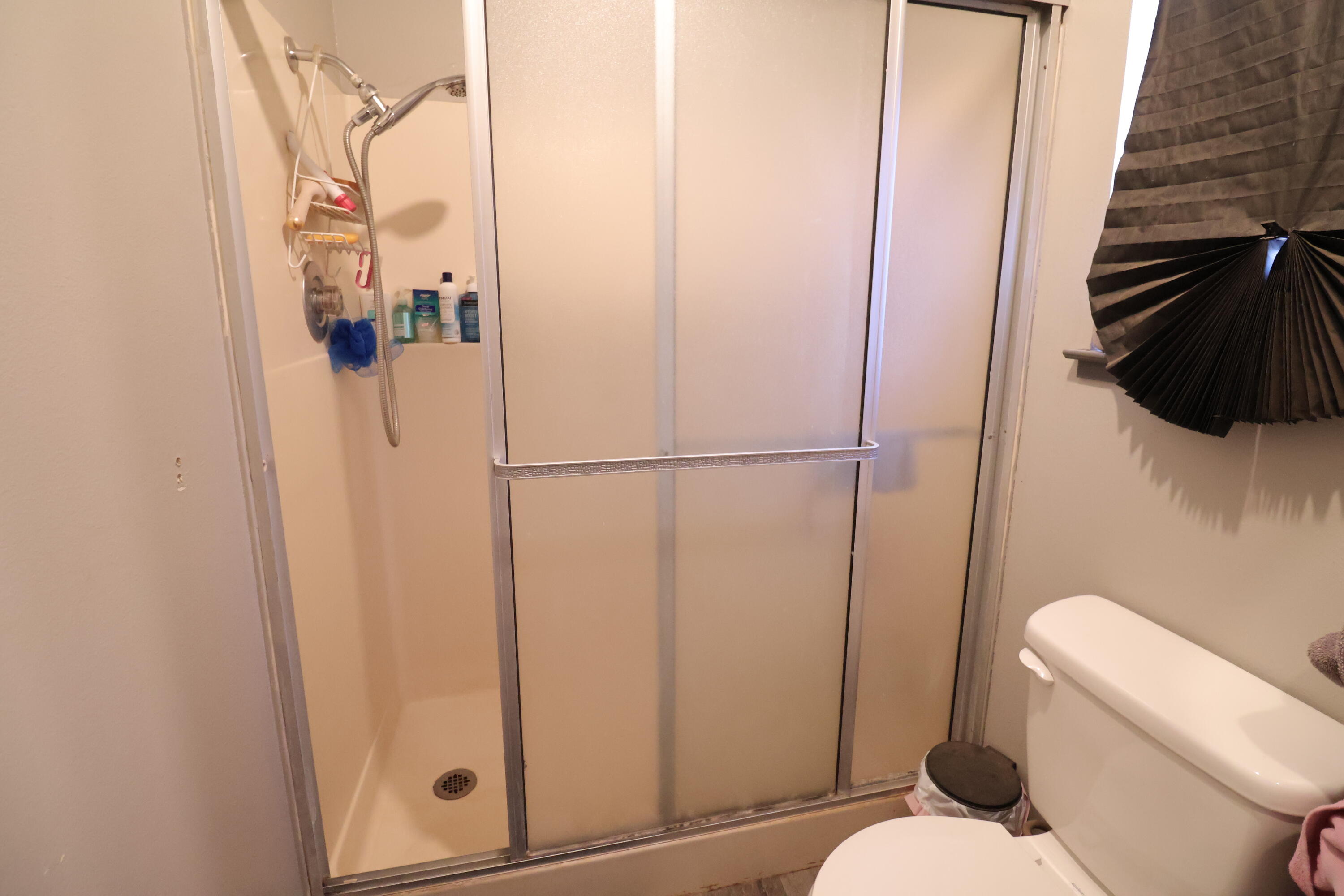 3528 Silverwood Street Redding, CA 96002 - Photo 10 of 13 a bathroom with a toilet and a shower