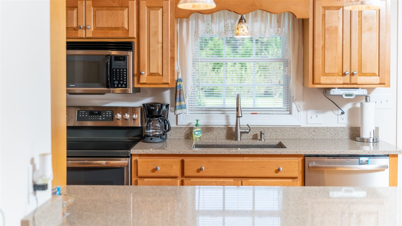 2034 Mt Torrey Road Lyndhurst, VA 22952 - Photo 23 of 50 a kitchen with granite countertop a sink and a stove top oven