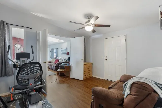 a view of a livingroom with furniture and wooden floor
