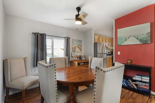 a view of a dining room with furniture and window
