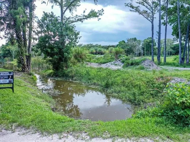 a view of a lake with a yard