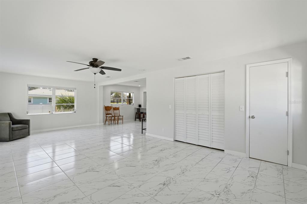 231 North Ridgewood Avenue Ormond Beach, FL 32174 - Photo 12 of 52 a view of livingroom with furniture and ceiling fan