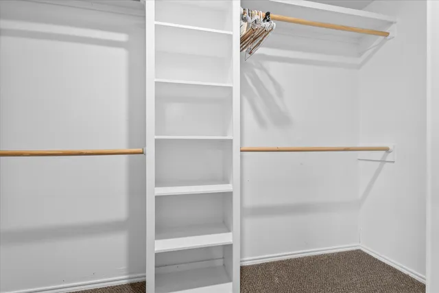 a view of an empty walk in closet