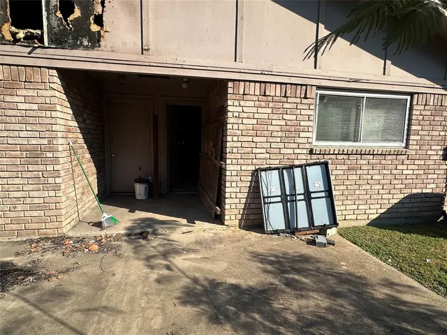 a view of backyard with swimming pool