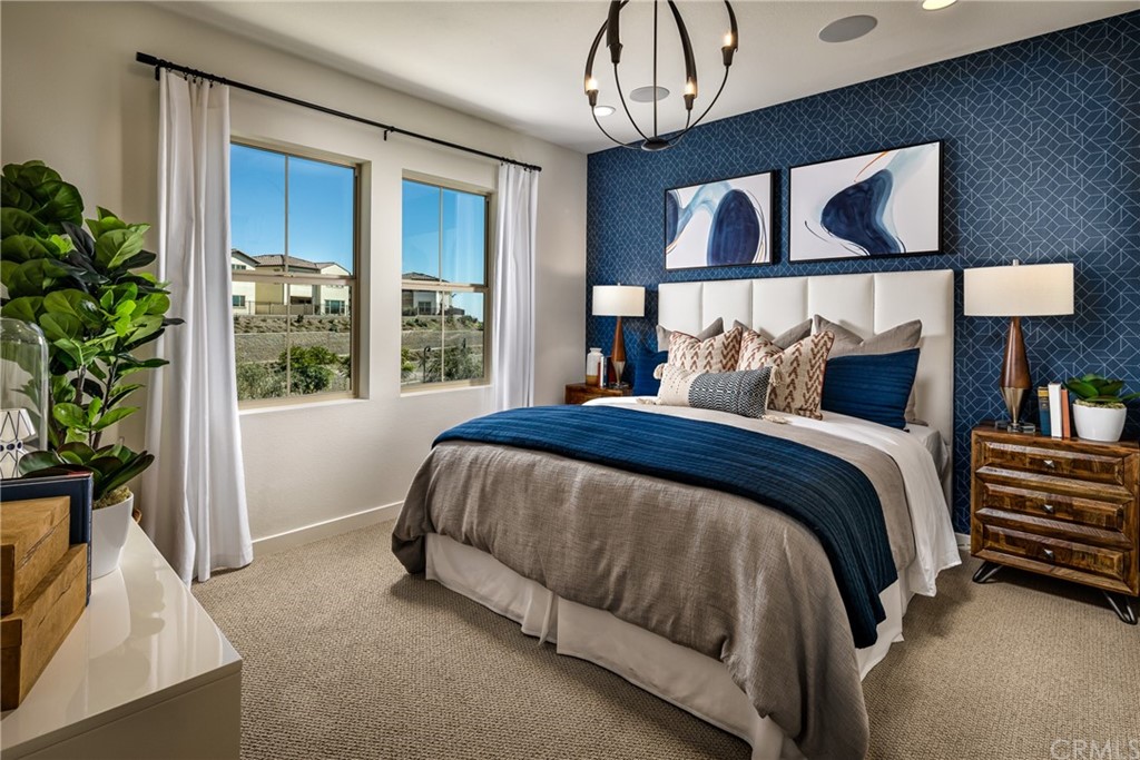 422 Coyote Pass Blanchard, ID 83804 - Photo 4 of 7 a bed sitting in a bedroom next to a window