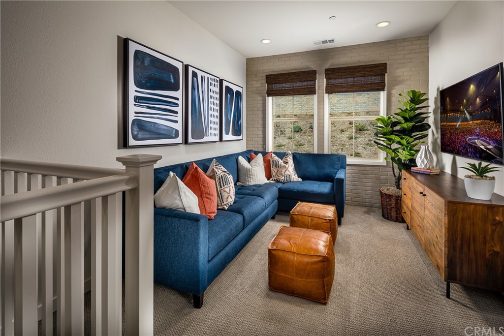 422 Coyote Pass Blanchard, ID 83804 - Photo 6 of 7 a living room with furniture and a flat screen tv
