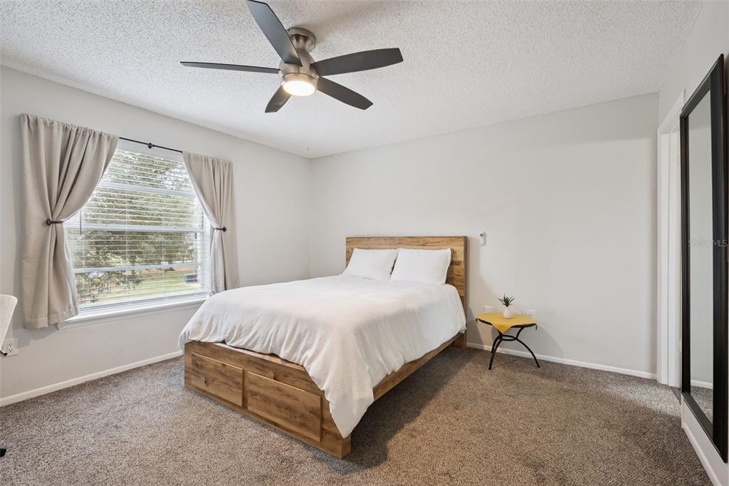 112 Reserve Circle, Unit 212 Oviedo, FL 32765 - Photo 11 of 54 a bedroom with a bed and a window