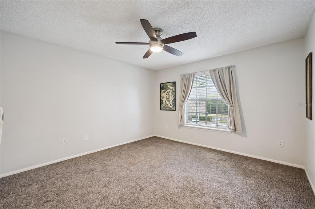 112 Reserve Circle, Unit 212 Oviedo, FL 32765 - Photo 12 of 54 a view of an empty room with a window