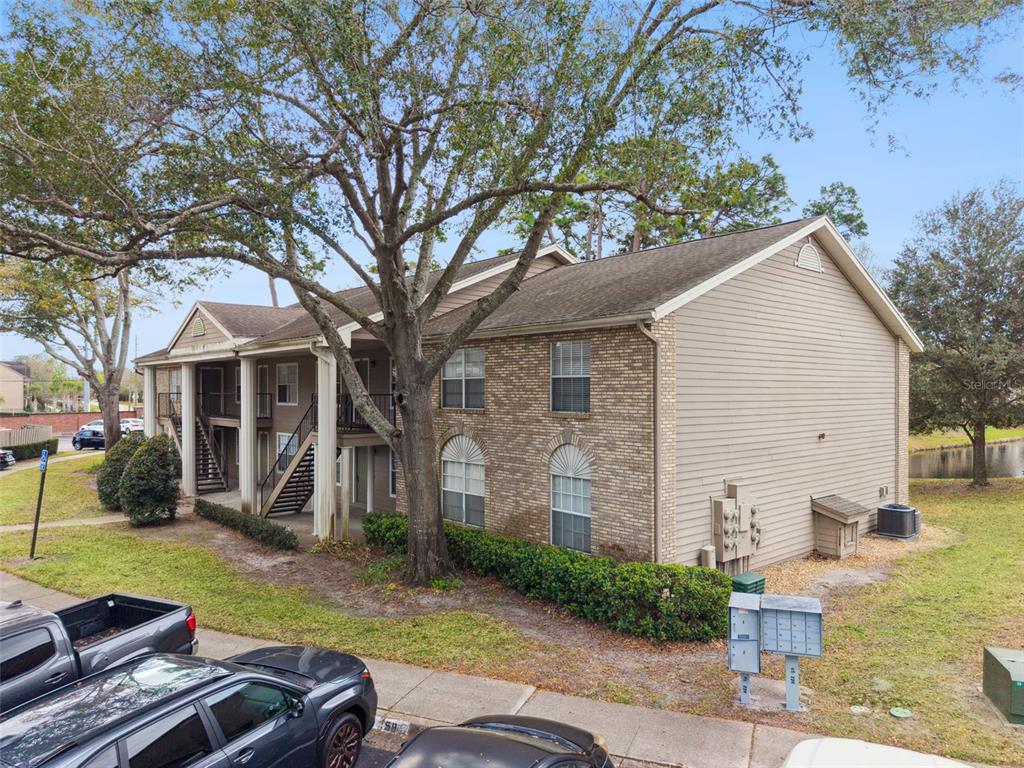 112 Reserve Circle, Unit 212 Oviedo, FL 32765 - Photo 21 of 54 front view of a house with a yard