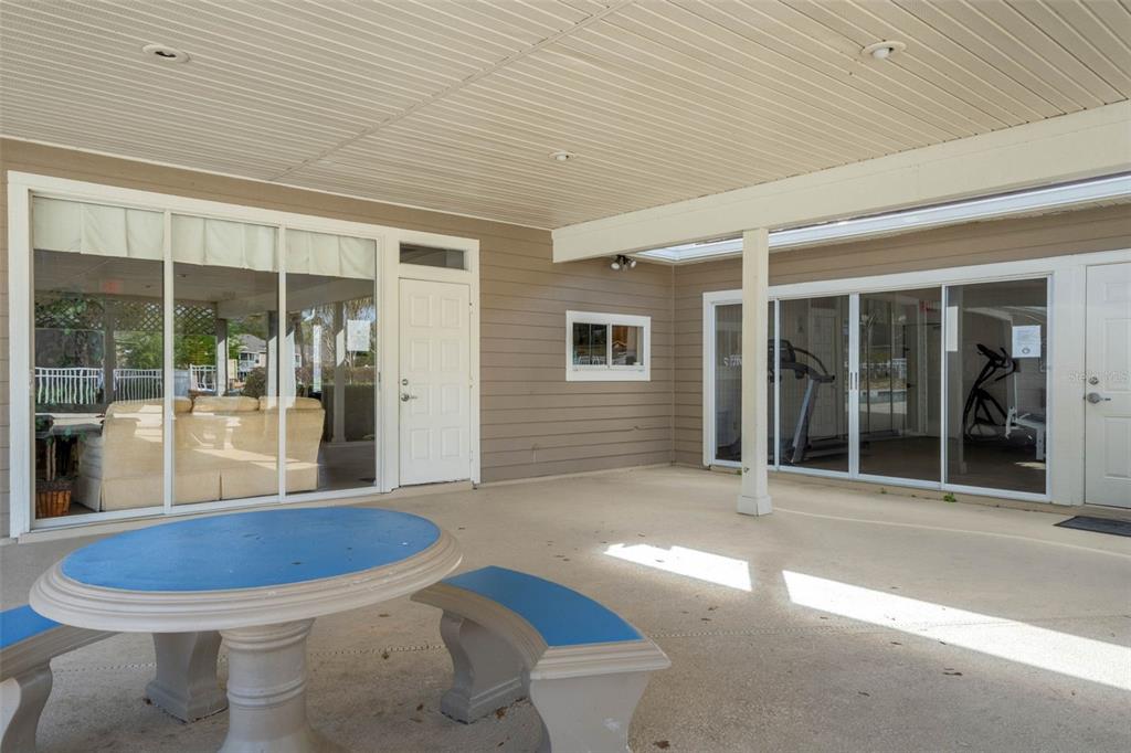 112 Reserve Circle, Unit 212 Oviedo, FL 32765 - Photo 24 of 54 a view of a patio with table and chairs