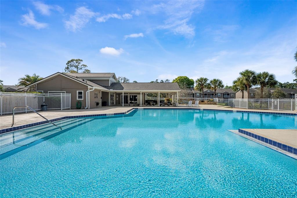 112 Reserve Circle, Unit 212 Oviedo, FL 32765 - Photo 27 of 54 a view of a house with a big yard