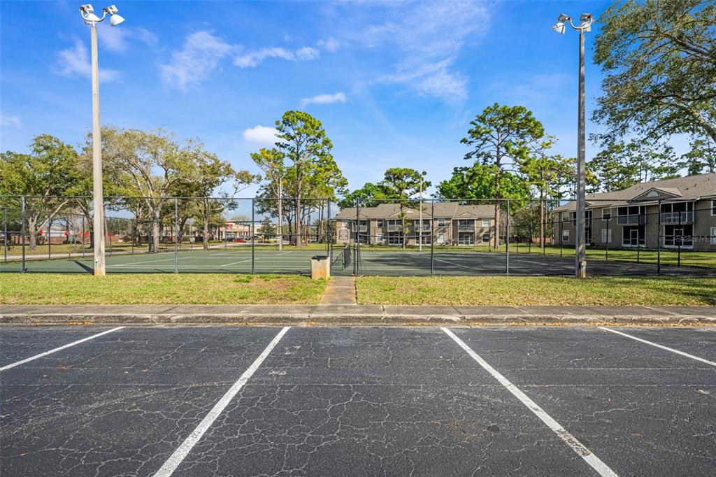 112 Reserve Circle, Unit 212 Oviedo, FL 32765 - Photo 33 of 54 a view of a swimming pool with a lawn chairs