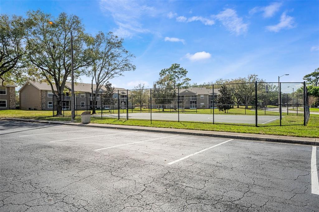 112 Reserve Circle, Unit 212 Oviedo, FL 32765 - Photo 34 of 54 a view of a playground with basketball court
