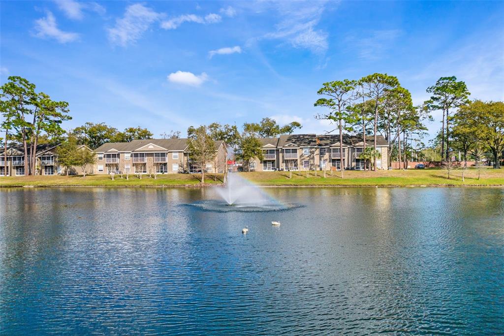 112 Reserve Circle, Unit 212 Oviedo, FL 32765 - Photo 38 of 54 a view of a lake with houses