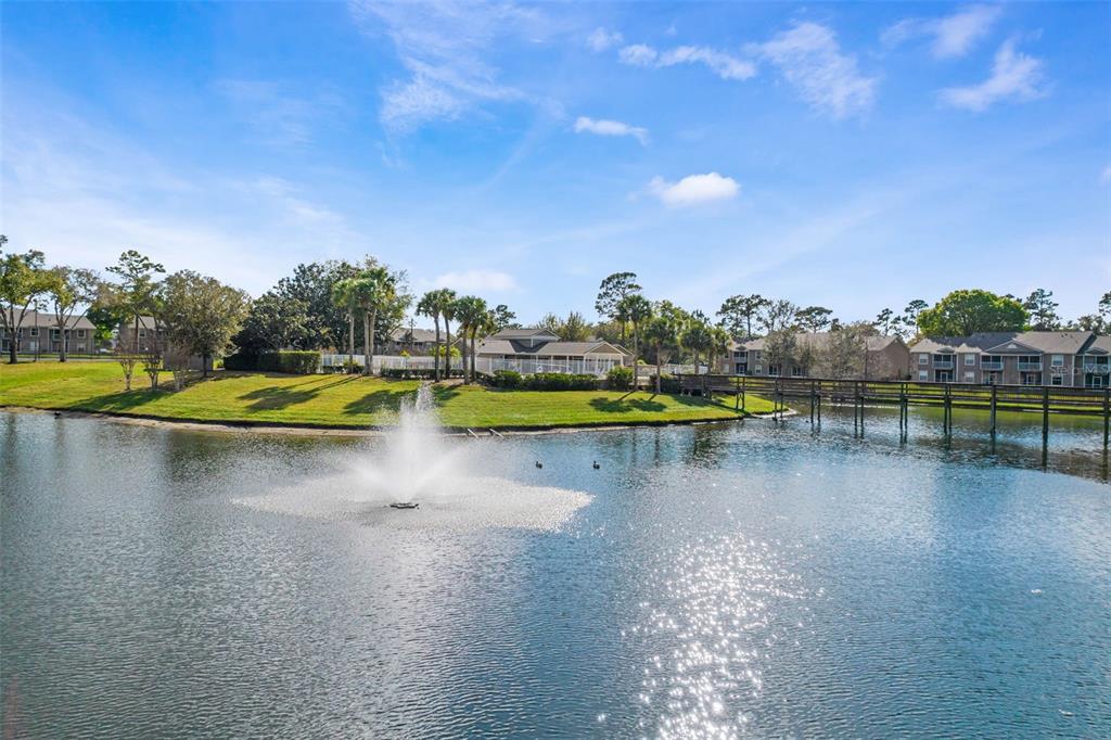 112 Reserve Circle, Unit 212 Oviedo, FL 32765 - Photo 39 of 54 a view of a swimming pool with an outdoor space and seating area