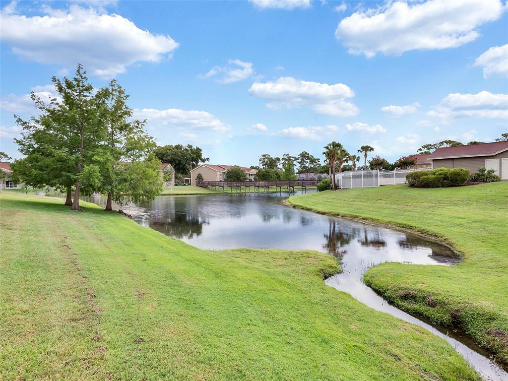 112 Reserve Circle, Unit 212 Oviedo, FL 32765 - Photo 40 of 54 a view of a lake with houses