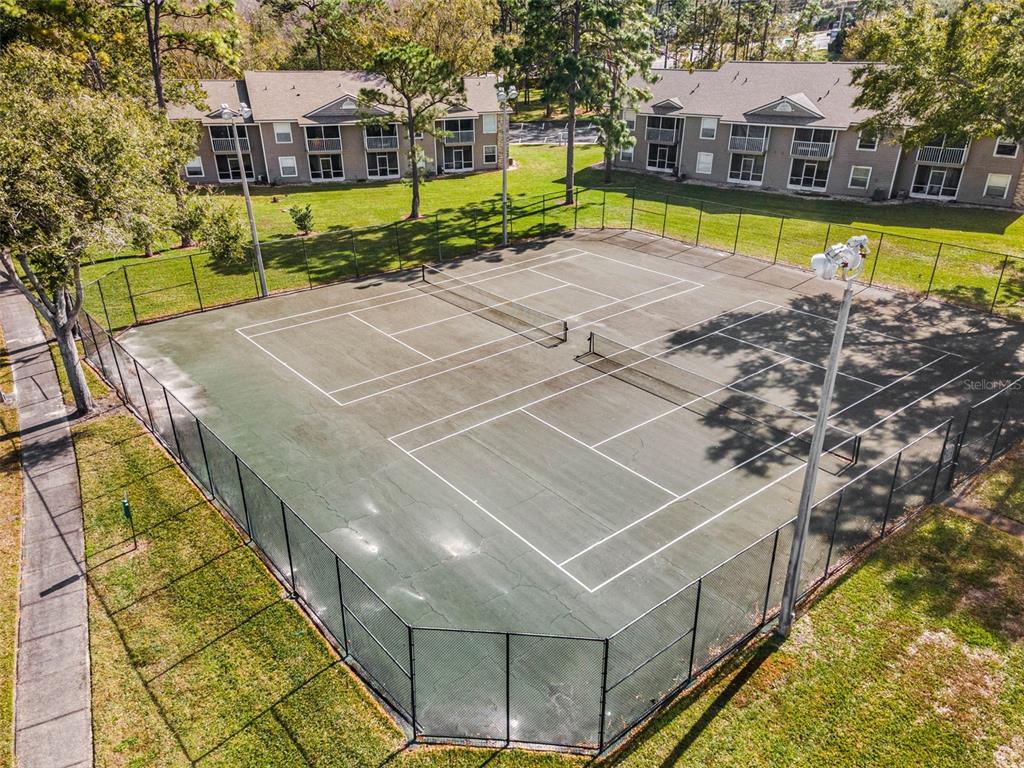 112 Reserve Circle, Unit 212 Oviedo, FL 32765 - Photo 41 of 54 a view of a swimming pool with a patio and a yard