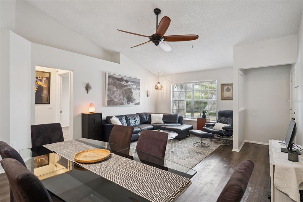 112 Reserve Circle, Unit 212 Oviedo, FL 32765 - Photo 5 of 54 a living room with furniture and a large window
