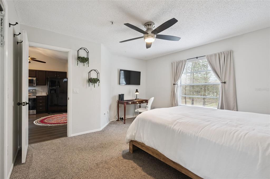 112 Reserve Circle, Unit 212 Oviedo, FL 32765 - Photo 10 of 54 a bedroom with a bed and a large window