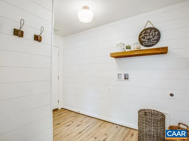 a bedroom with a bed and a lamp