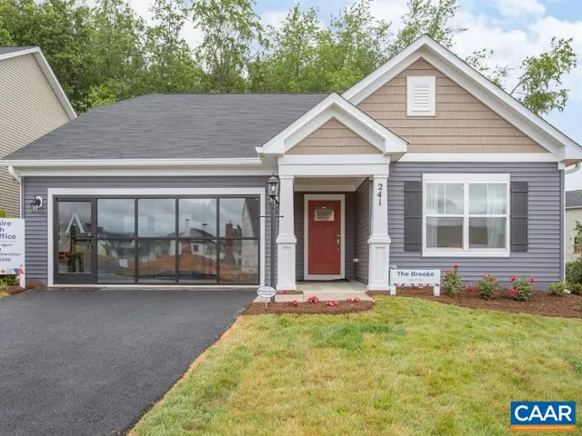 a view of house with yard